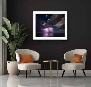 Coastal Storm framed in a dark contemporary interior