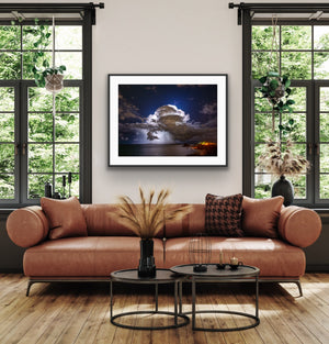Storm over Nobby's framed above a leather sofa in a contemporary living room