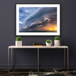 Sunset Storm framed in a dark contemporary interior